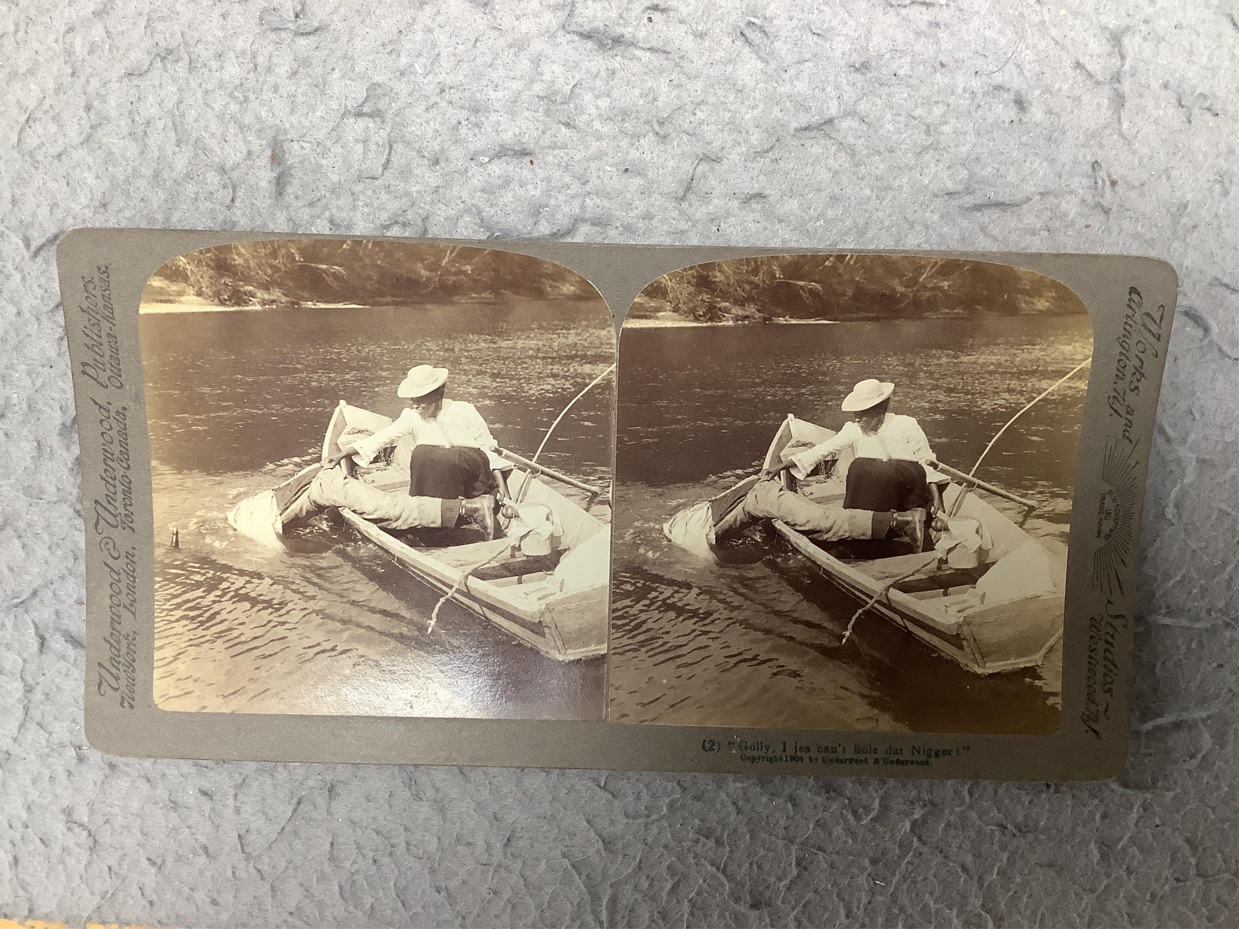 A stereoscope viewer with a collection of comical viewing cards. Condition - cards - fair/good, viewer - poor